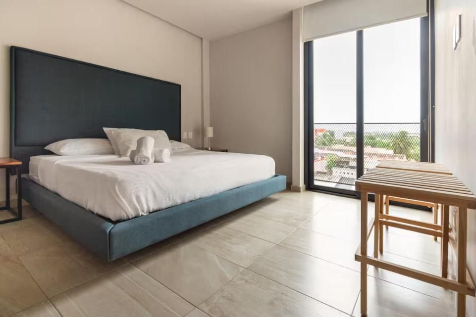 Bedroom with King bed and balcony door